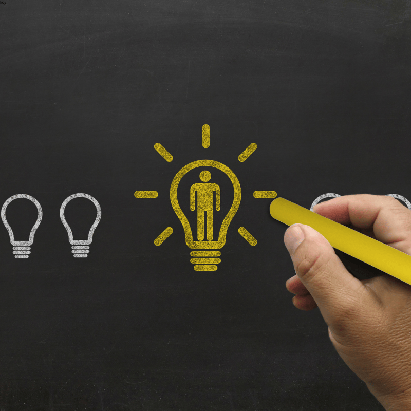 Yellow chalk lightbulb symbolizing our innovation in sustainable packaging