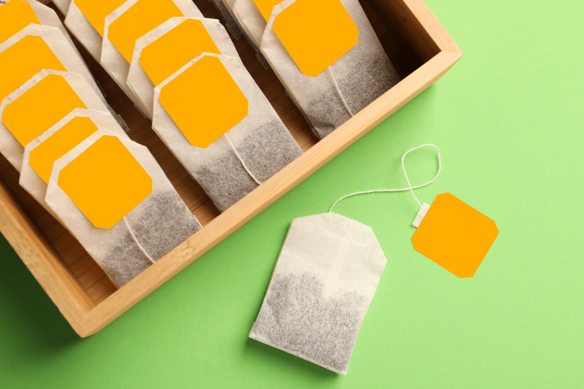 String and tag tea bags packed in a wooden box, produced by IMA packaging machine