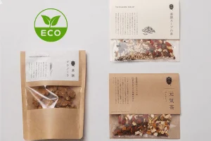 Eco friendly kraft paper pouches with clear windows for tea, soup, and granola packaging