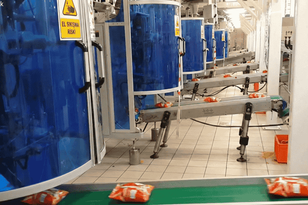 Flexible packaging film running smoothly on an automated packaging machine, showing stable sealing, accurate tracking, and consistent production performance.